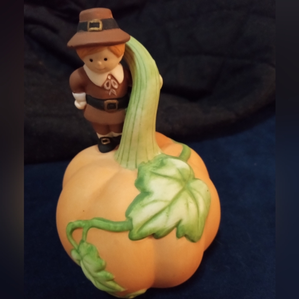 Avon Pilgrim Figurine on Pumpkin Bell